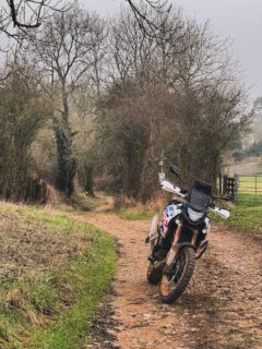 Thank god winter’s done. Am I the only one who thinks UK winter riding is shit? And no, I don’t mean the cold — that’s a solved problem. Heated grips, decent kit, decent tyres, layer up, crack on. 4°C is fine. I’ll ride in that all day. It’s the bloody salt. The crap they tip on every road from October to March. Within ten miles of leaving the drive your bike looks like it’s been dragged through a chip shop. It gets into every bolt, every linkage, every bit of the chain your brush can’t reach — and it’s still chewing your rims three months after the bike’s been tucked up for winter. So you’ve got two options. Ride and then spend an hour scrubbing the thing down when you get home, because if you don’t, that salt is eating metal by morning. Or don’t ride — because what’s the point of a bike that looks like it’s been pulled out of a hedge after every outing. There’s no third option. ACF-50, Scottoiler, fancy covers — they help, a lot but they don’t fix it. This is what puts me off from riding during the winter :( Tell me I’m not alone in this. What’s your routine — full strip-down every time, or just send it and let the bike take the hit? #malonmoto #rideuk #ukbikers #adventurerider #nobullshit